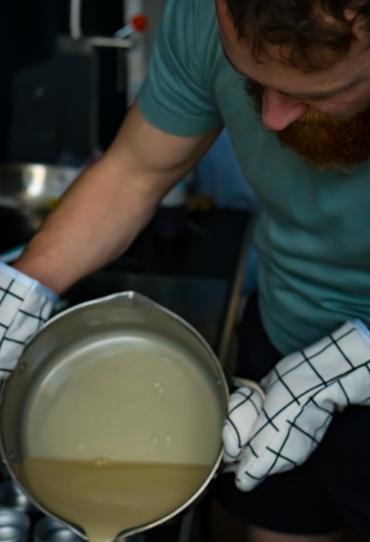 man making beard balm